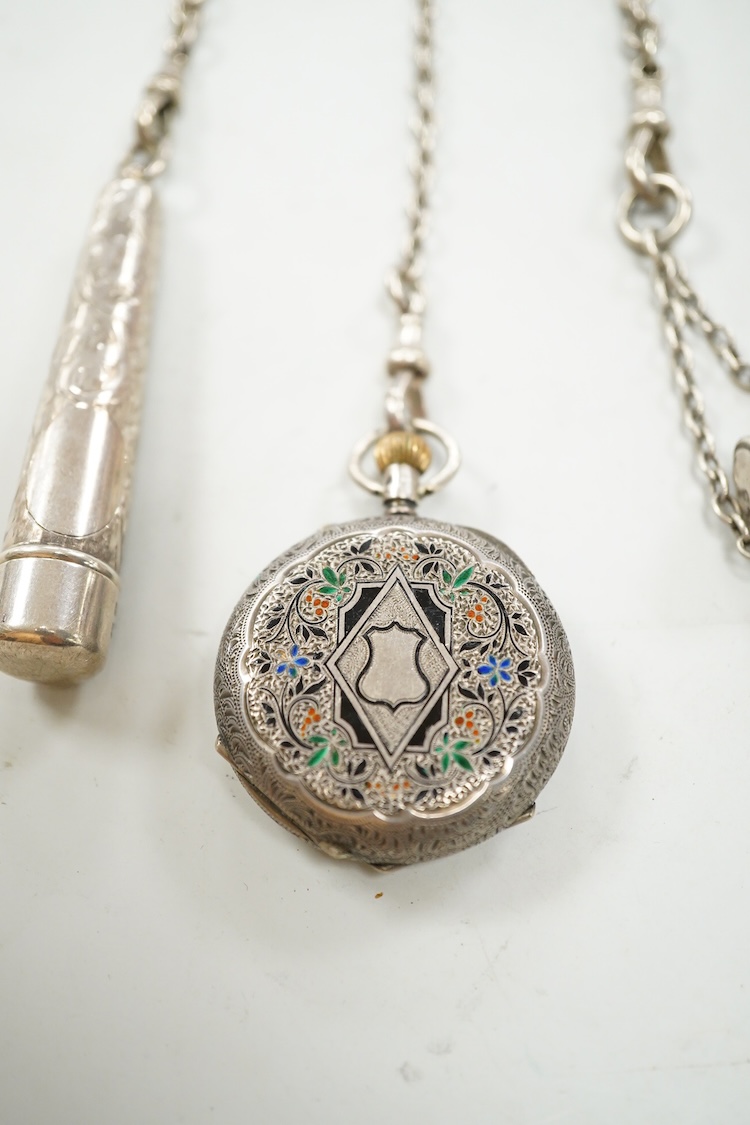 An Edwardian pierced silver chatelaine, by Samuel Jacob, London, 1902, with three accoutrements to include two silver cases and a enamelled fob watch, overall length 34cm.